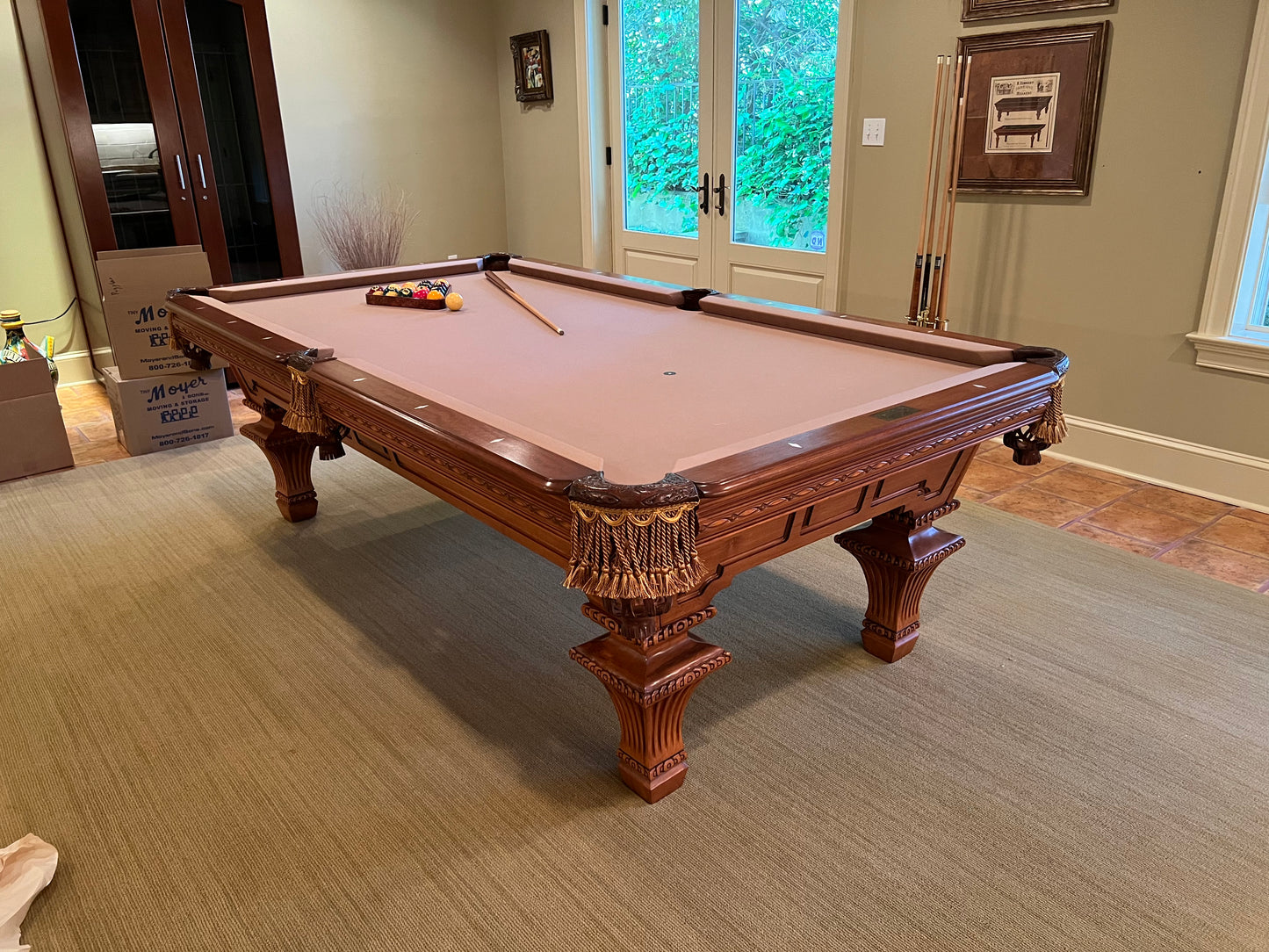 Wooden pool table in a room