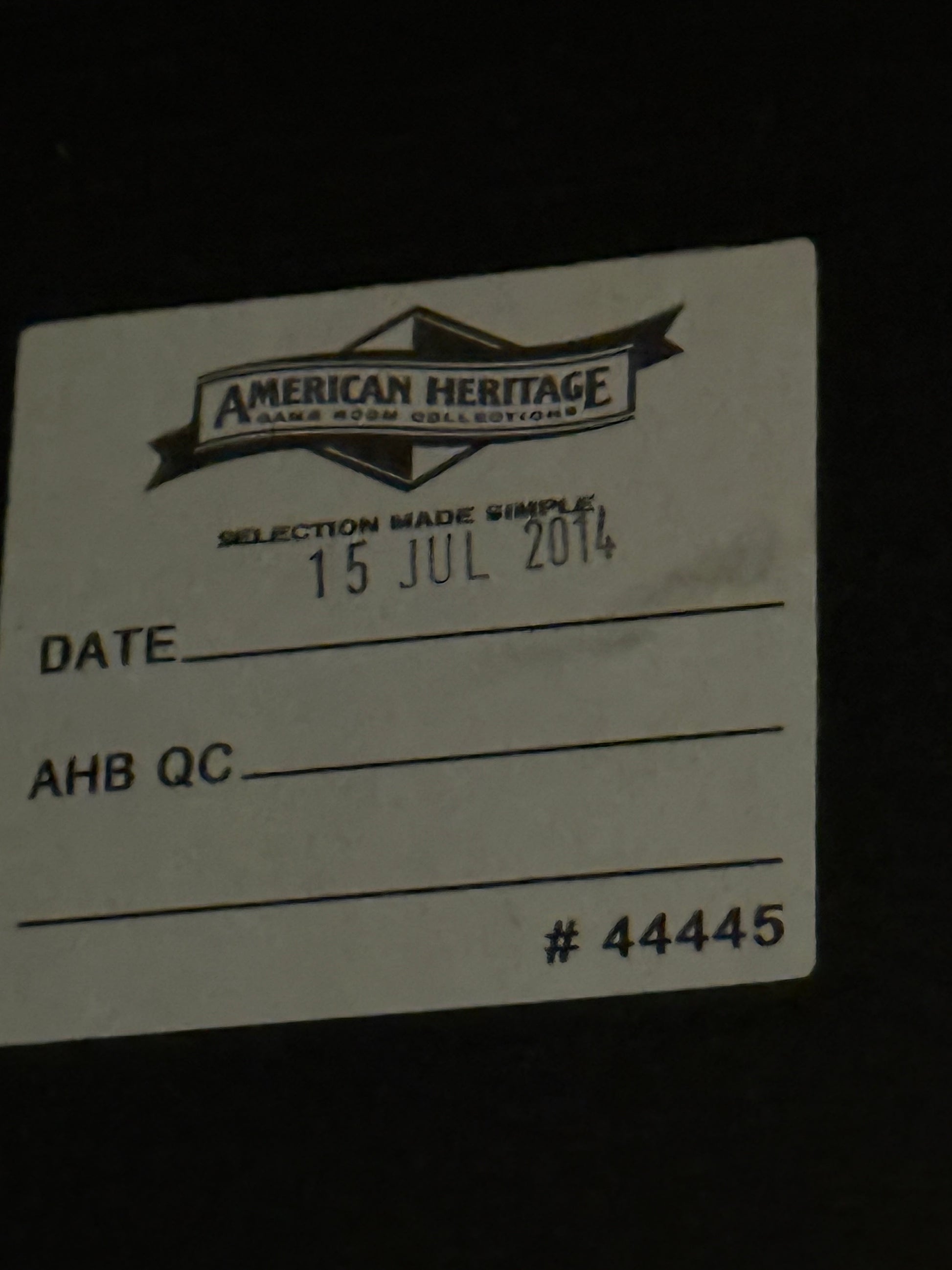 White card with black text and 'American Heritage' logo on a dark background
