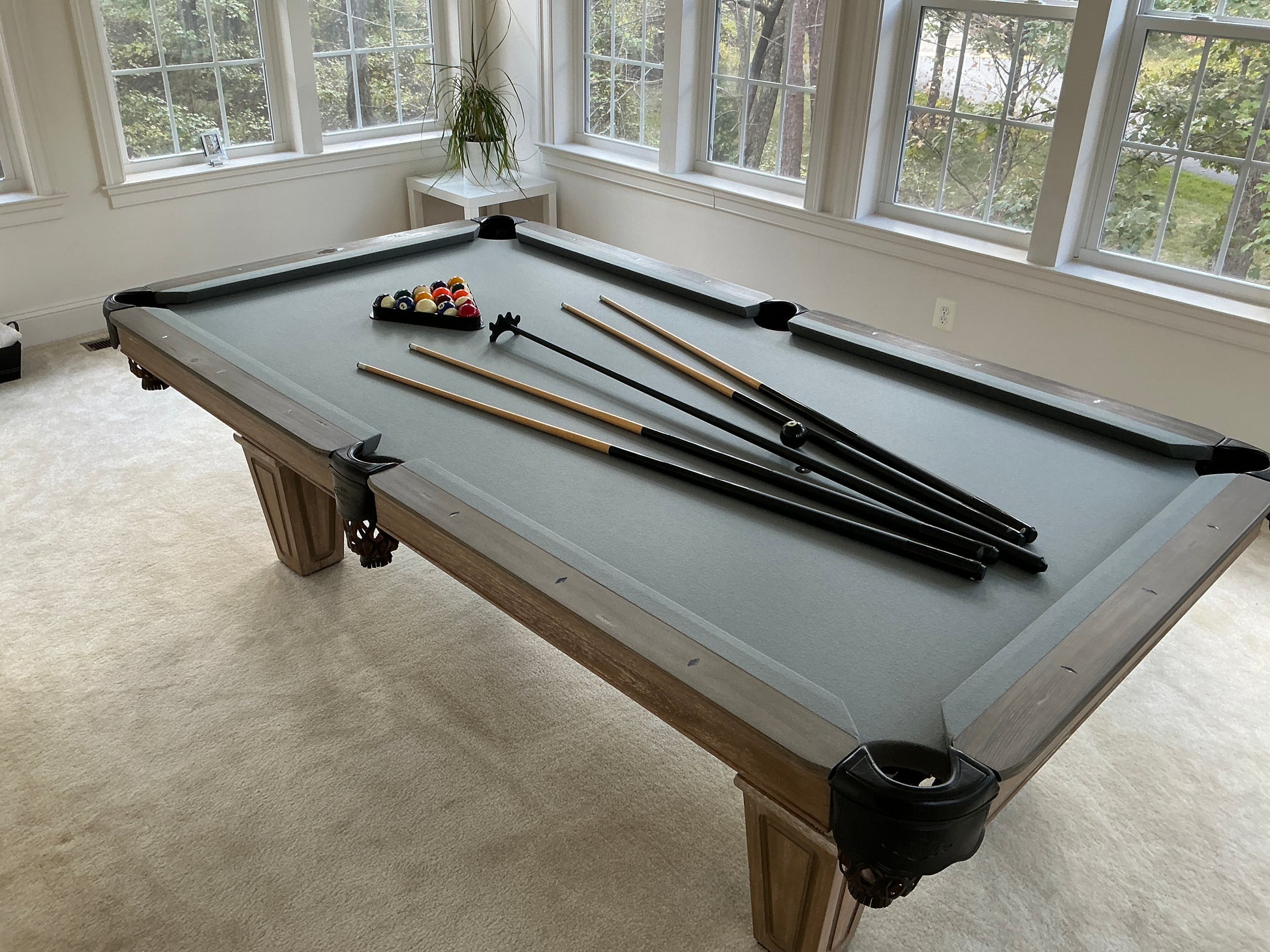 Pool table with cues and balls