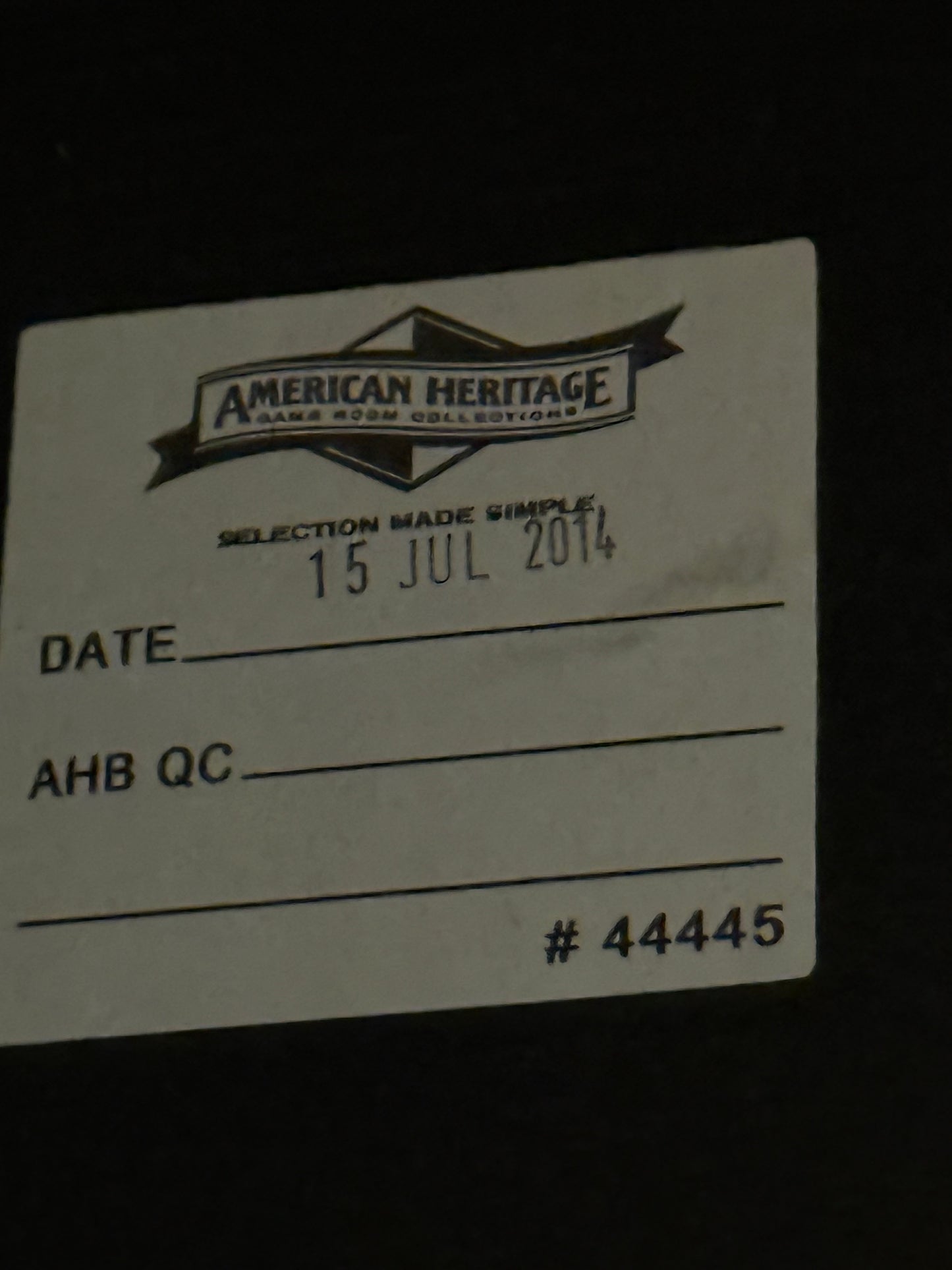 White card with black text and 'American Heritage' logo on a dark background