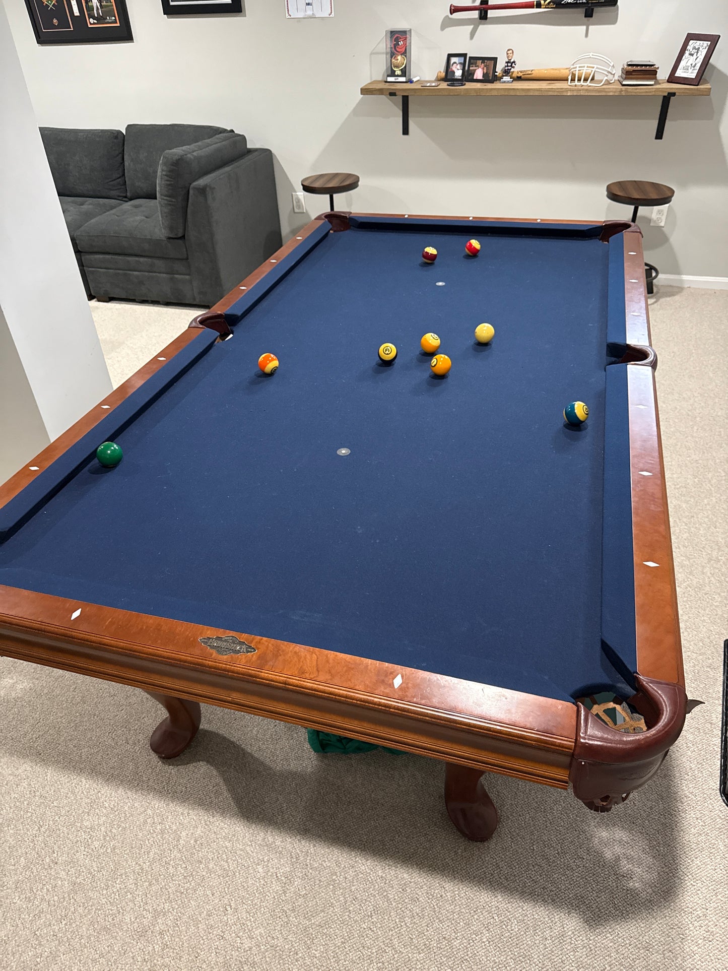 Wood pool table with blue felt